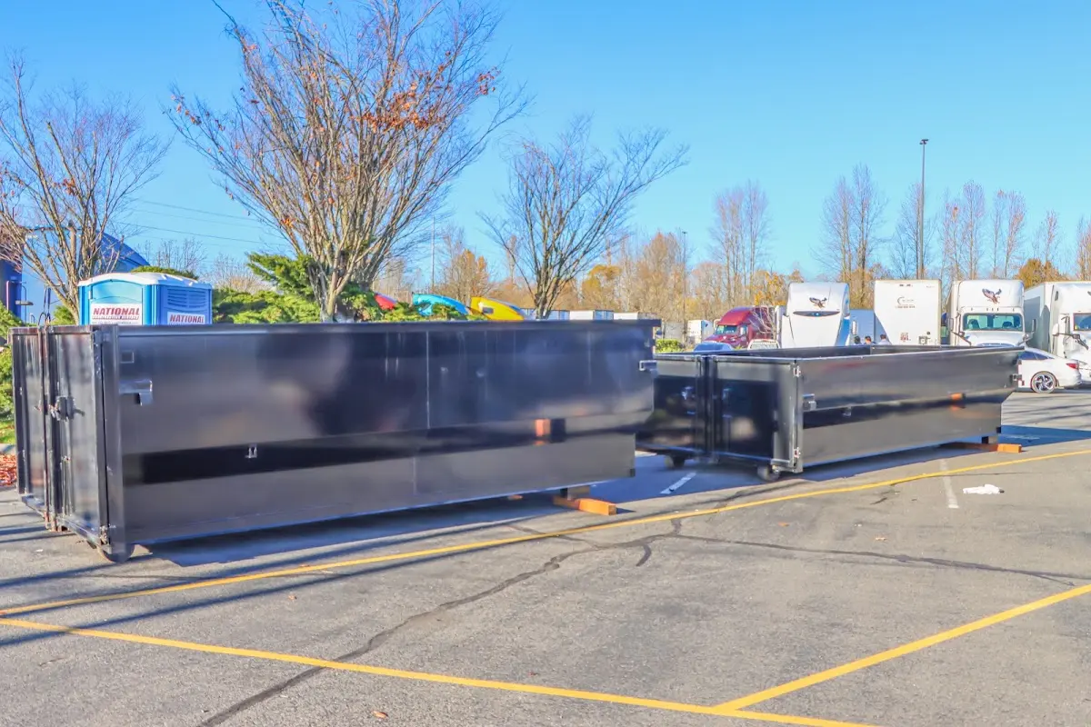 Professional dumpster rental service with roll-off container on residential driveway in Mukilteo